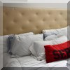 F52. King bed with upholstered headboard. 